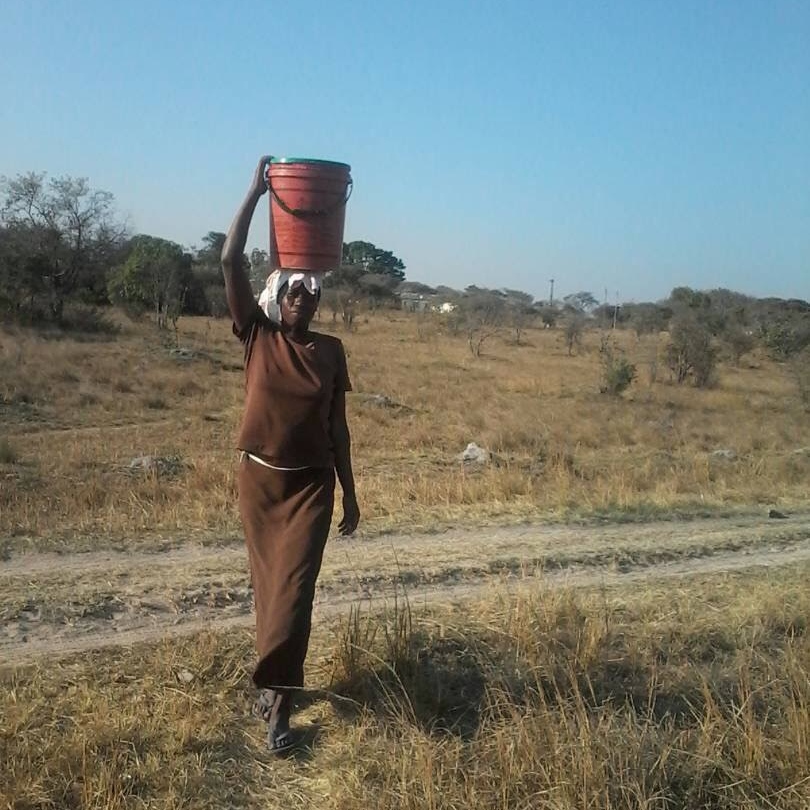 Maria collects water for her family